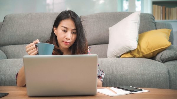 Young business freelance Asian woman working on laptop checking