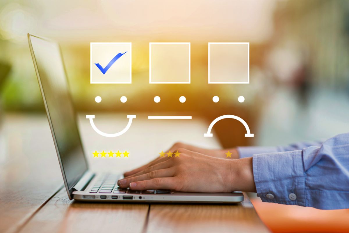 A businessman filling out an NPS survey on his laptop